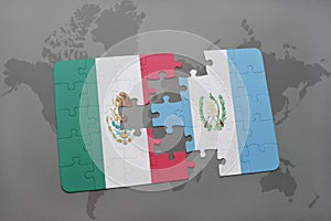 puzzle with the national flag of mexico and guatemala on a world map background.