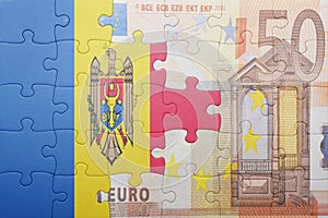 Puzzle with the national flag of moldova and euro banknote