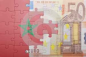 Puzzle with the national flag of morocco and euro banknote