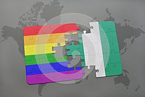 puzzle with the national flag of nigeria and gay rainbow flag on a world map background.