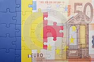 Puzzle with the national flag of romania and euro banknote
