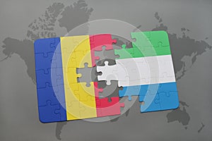 puzzle with the national flag of romania and sierra leone on a world map