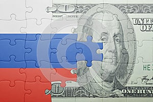 Puzzle with the national flag of russia and dollar banknote