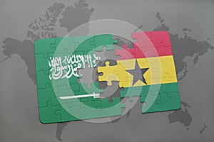 puzzle with the national flag of saudi arabia and ghana on a world map background.
