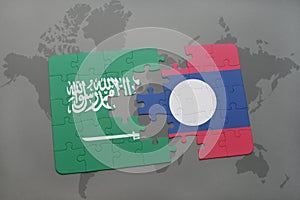 puzzle with the national flag of saudi arabia and laos on a world map background.