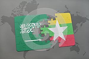 puzzle with the national flag of saudi arabia and myanmar on a world map background.