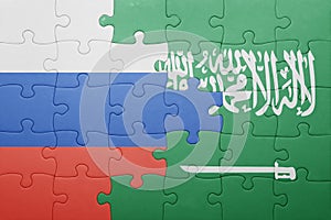 Puzzle with the national flag of saudi arabia and russia