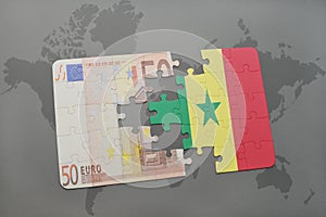 puzzle with the national flag of senegal and euro banknote on a world map background.