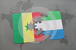 puzzle with the national flag of senegal and sierra leone on a world map