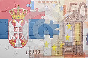 Puzzle with the national flag of serbia and euro banknote