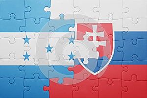 Puzzle with the national flag of slovakia and honduras