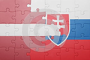 Puzzle with the national flag of slovakia and latvia