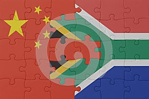 puzzle with the national flag of south africa and china . macro.concept