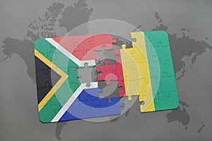 puzzle with the national flag of south africa and guinea on a world map.