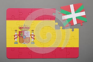 Puzzle with national flag of Spain and Basque Country piece detached.