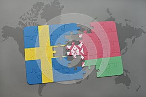 puzzle with the national flag of sweden and belarus on a world map background.