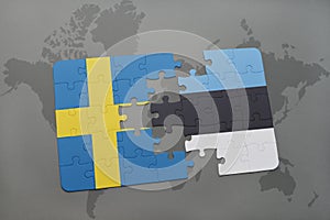 puzzle with the national flag of sweden and estonia on a world map background.