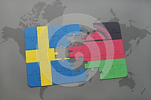 puzzle with the national flag of sweden and malawi on a world map background.