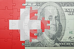 Puzzle with the national flag of switzerland and dollar banknote