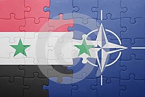 Puzzle with the national flag of syria and nato