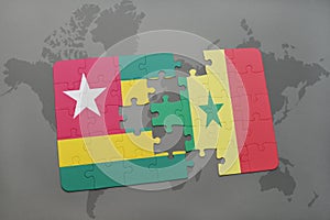 puzzle with the national flag of togo and senegal on a world map