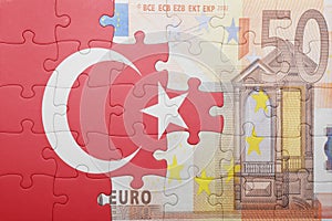 Puzzle with the national flag of turkey and euro banknote