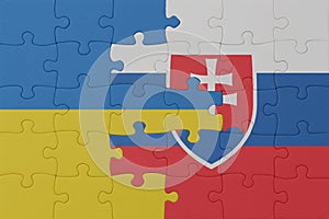 Puzzle with the national flag of ukraine and slovakia . macro.concept