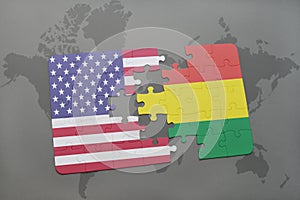Puzzle with the national flag of united states of america and bolivia on a world map background. concept