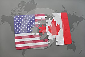 Puzzle with the national flag of united states of america and canada on a world map background