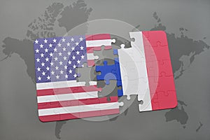 Puzzle with the national flag of united states of america and france on a world map background