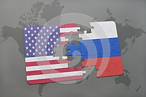 Puzzle with the national flag of united states of america and russia on a world map background