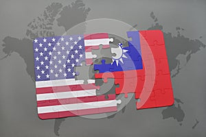 puzzle with the national flag of united states of america and taiwan on a world map background