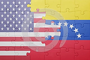 Puzzle with the national flag of united states of america and venezuela photo