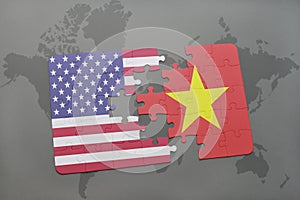 puzzle with the national flag of united states of america and vietnam on a world map background