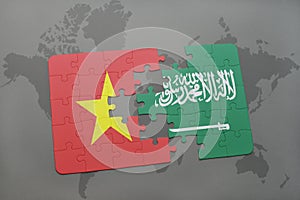 puzzle with the national flag of vietnam and saudi arabia on a world map background.