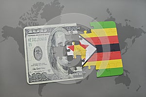 puzzle with the national flag of zimbabwe and dollar banknote on a world map background.