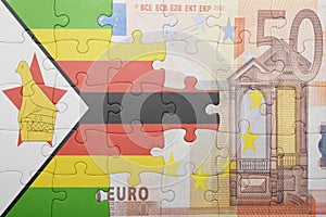 Puzzle with the national flag of zimbabwe and euro banknote