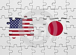 Puzzle with the national flags of United States of America and Japan