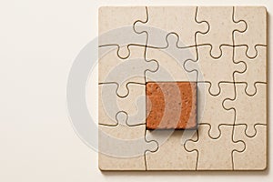 A puzzle with a piece of brick instead of a piece. Space for text.
