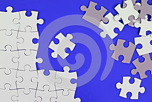 Puzzle pieces on blue background