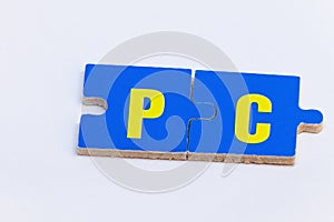 Puzzle pieces in blue and yellow forming the word PC