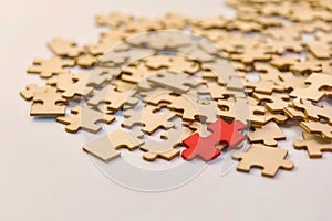 Puzzle pieces with one different colour piece, conceptual image of finding a puzzle