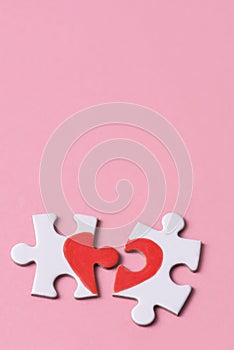 Puzzle pieces which form a heart photo