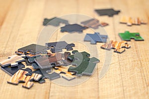 Puzzle pieces on a wooden background