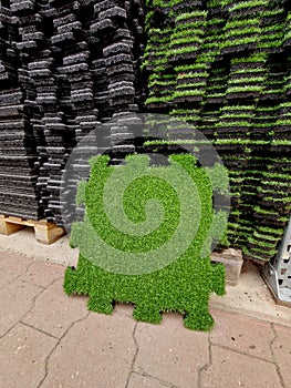 Puzzle rubber flooring with artificial grass is an ideal and elegant solution
