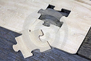 Puzzle on wooden boards team business concept