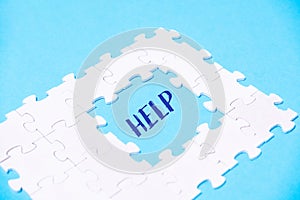 Puzzle with the word HELP written in the middle