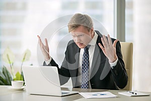 Puzzled businessman in office