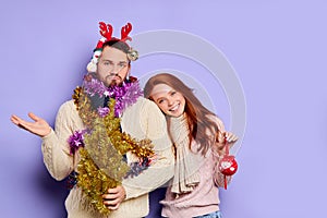 Puzzled man in Christmas tinsel