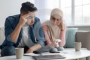 Puzzled muslim family feeling worry about their spendings